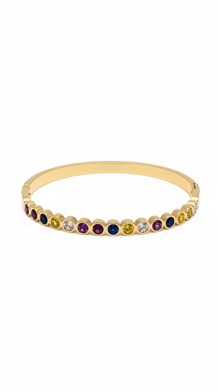 Gold bracelet with multicolored gemstones on a light gray background