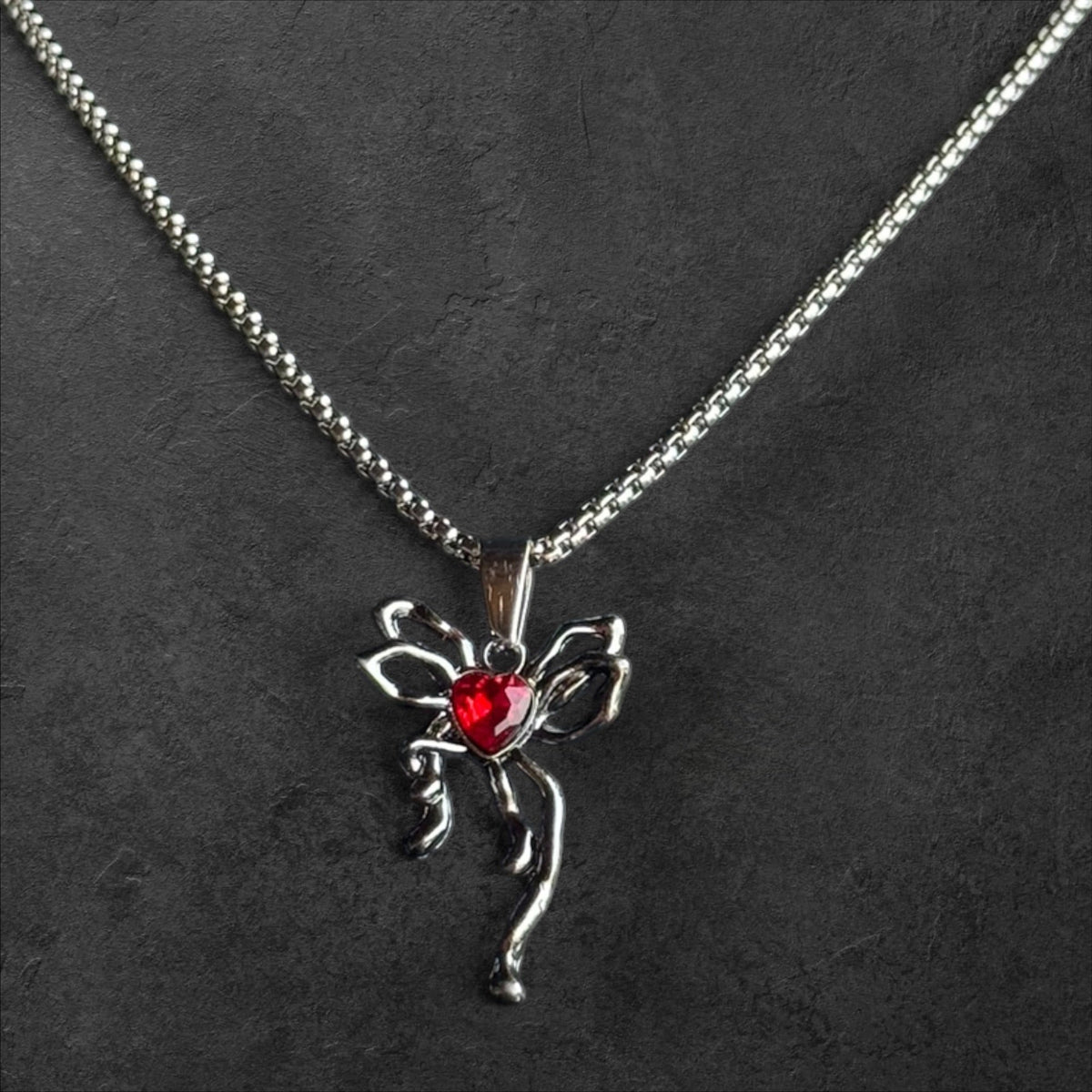 Elegant Heart Pendant Necklace with Ornate Bow Detail - rykardia